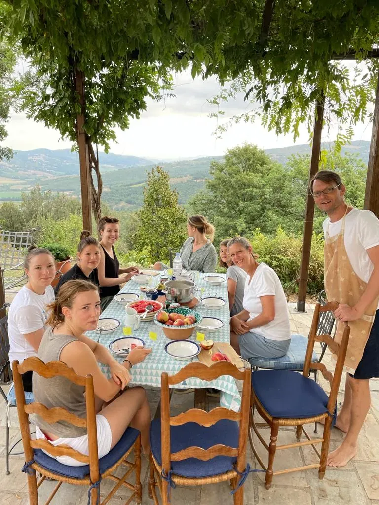 Guests gathered around the long table on the terrace