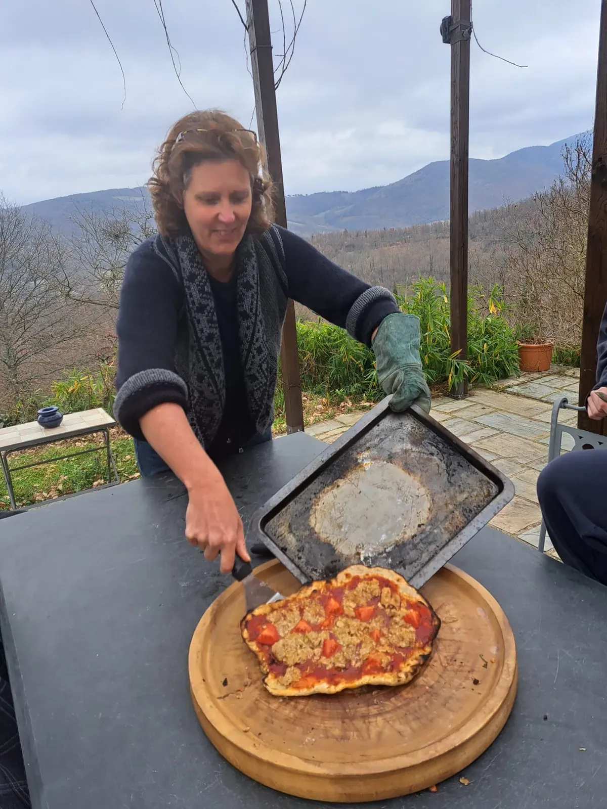 Pizza fresh from the wood oven on a board