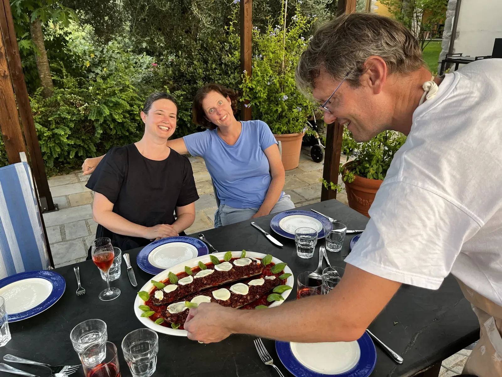 Samuel serving lunch on the terrace
